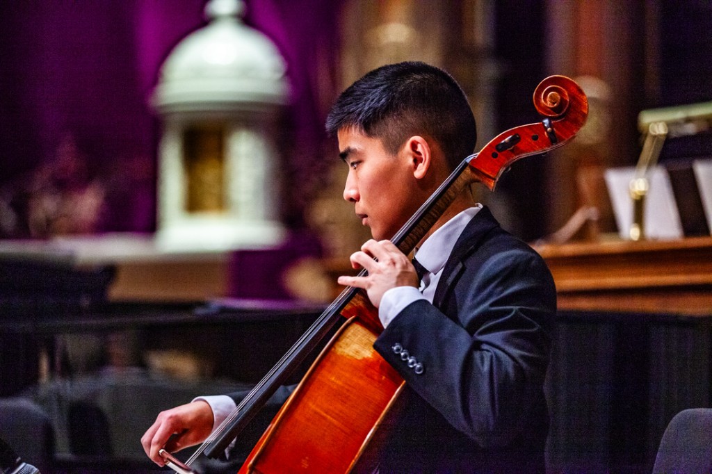 Oliver Tran playing cello